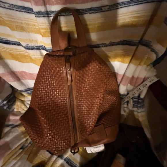 Brown Textured Backpack with Woven Pattern
